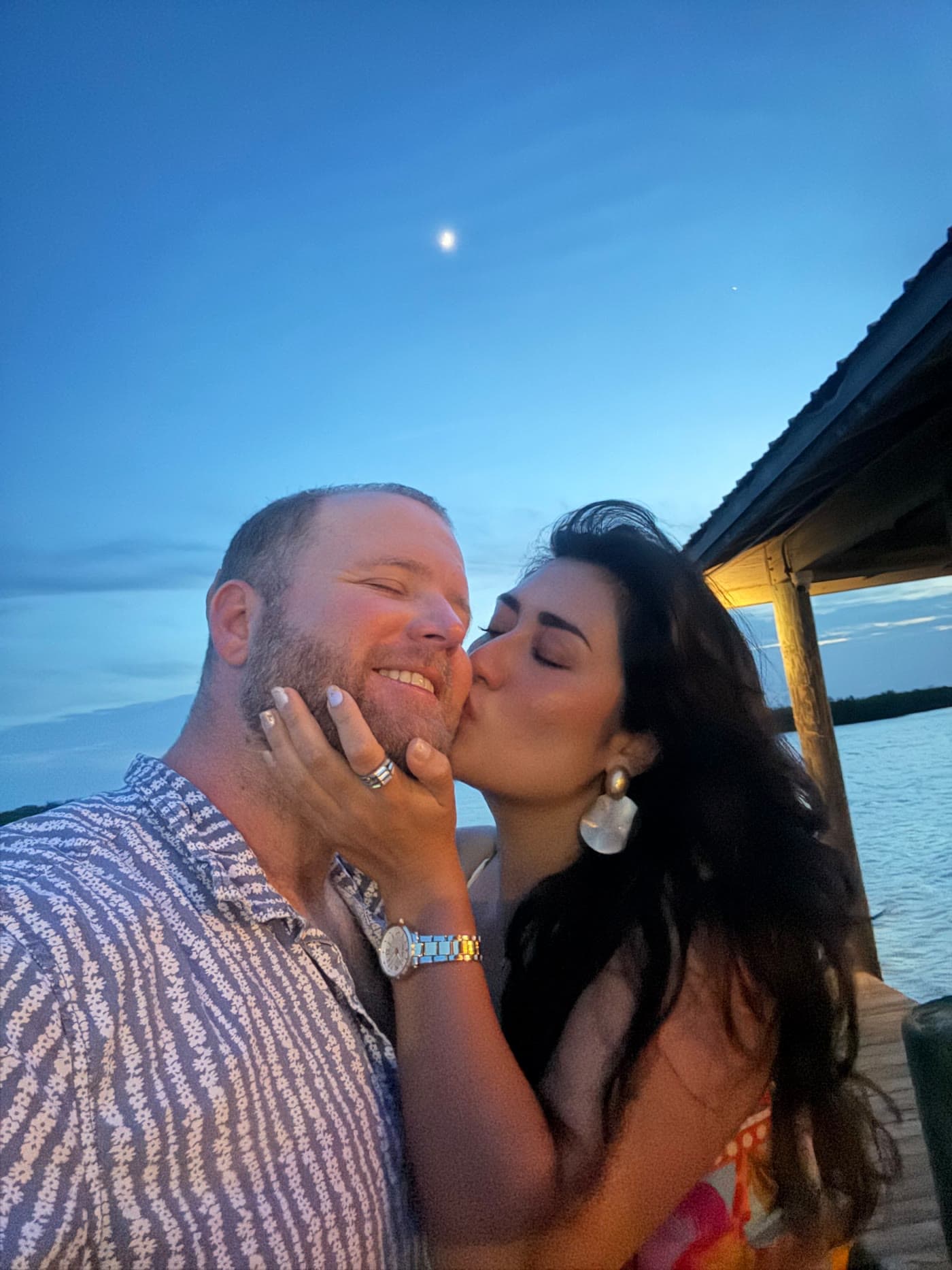 Nicole kisses Brenden on the cheek under the moon